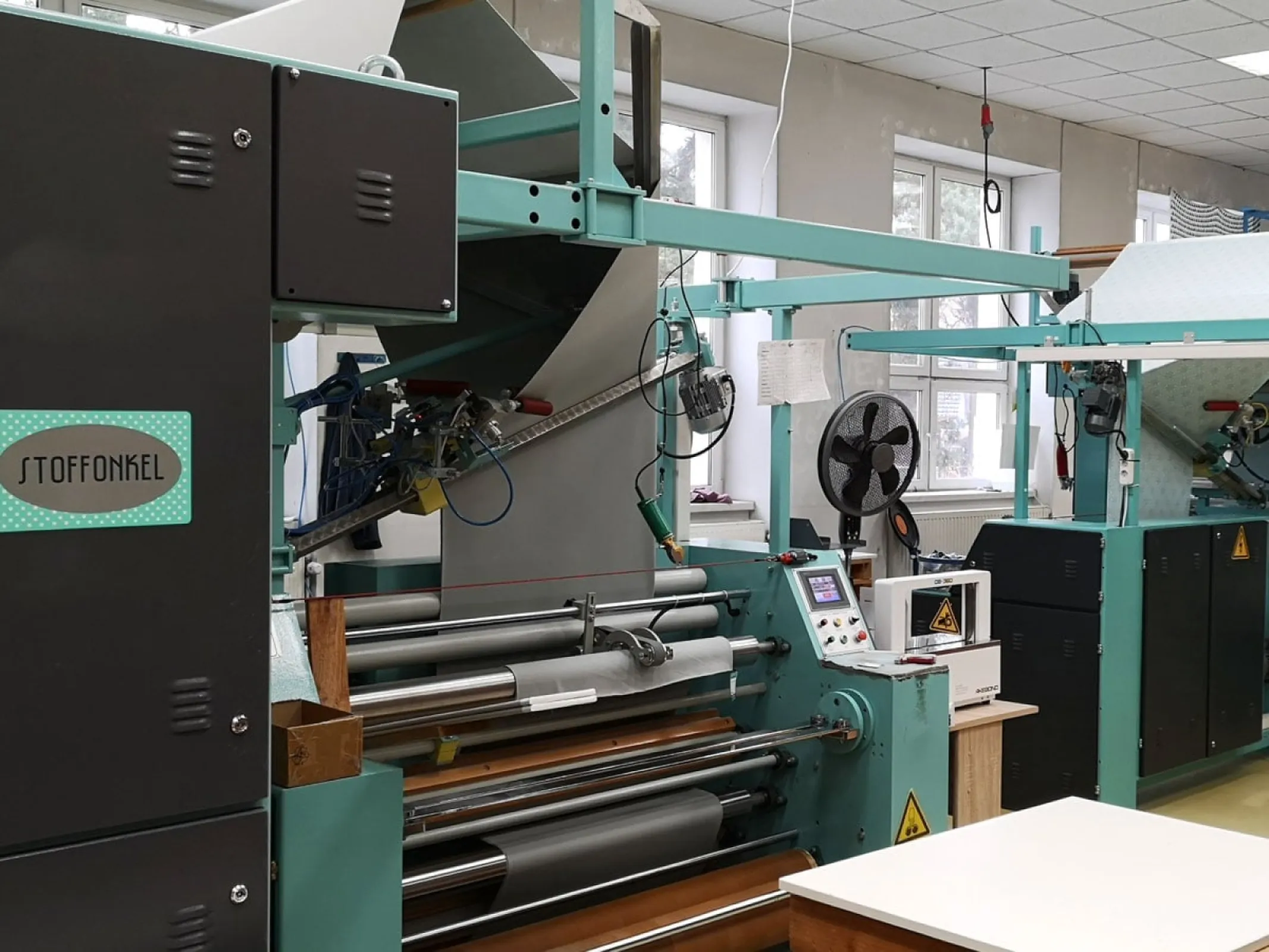 Our doubling machines. We are happy to provide your desired length of fabric doubled or on a roll.