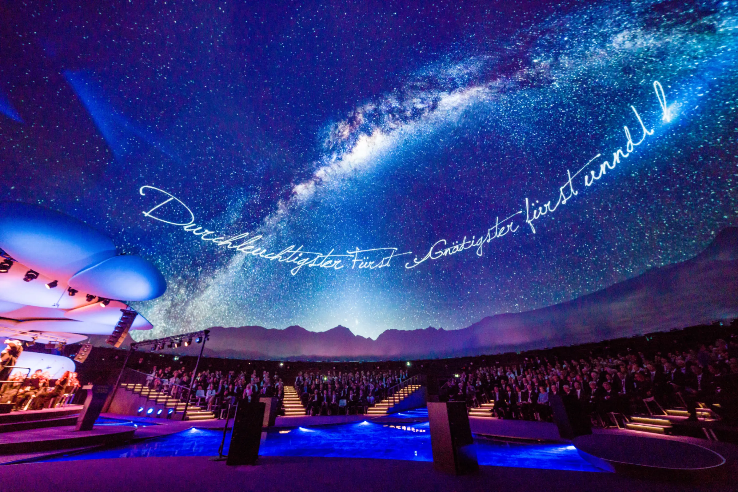 Merck KGaA – 350th Anniversary Celebration For Merck’s 350th anniversary, one of the largest dome tents ever built became the stage for an unforgettable celebration. The highlight: a spectacular ceremony with 900 guests and the Deutsche Philharmonie Merck. NIYU provided full technical consulting and management across lighting, audio, video, EDP, broadcast, and livestream — featuring a 360° projection and immersive sound with 25 projectors, 30 cameras, and 253 intelligent lights.  No dome projection is too big for NIYU — go bigger and better, engineered with precision in Germany.