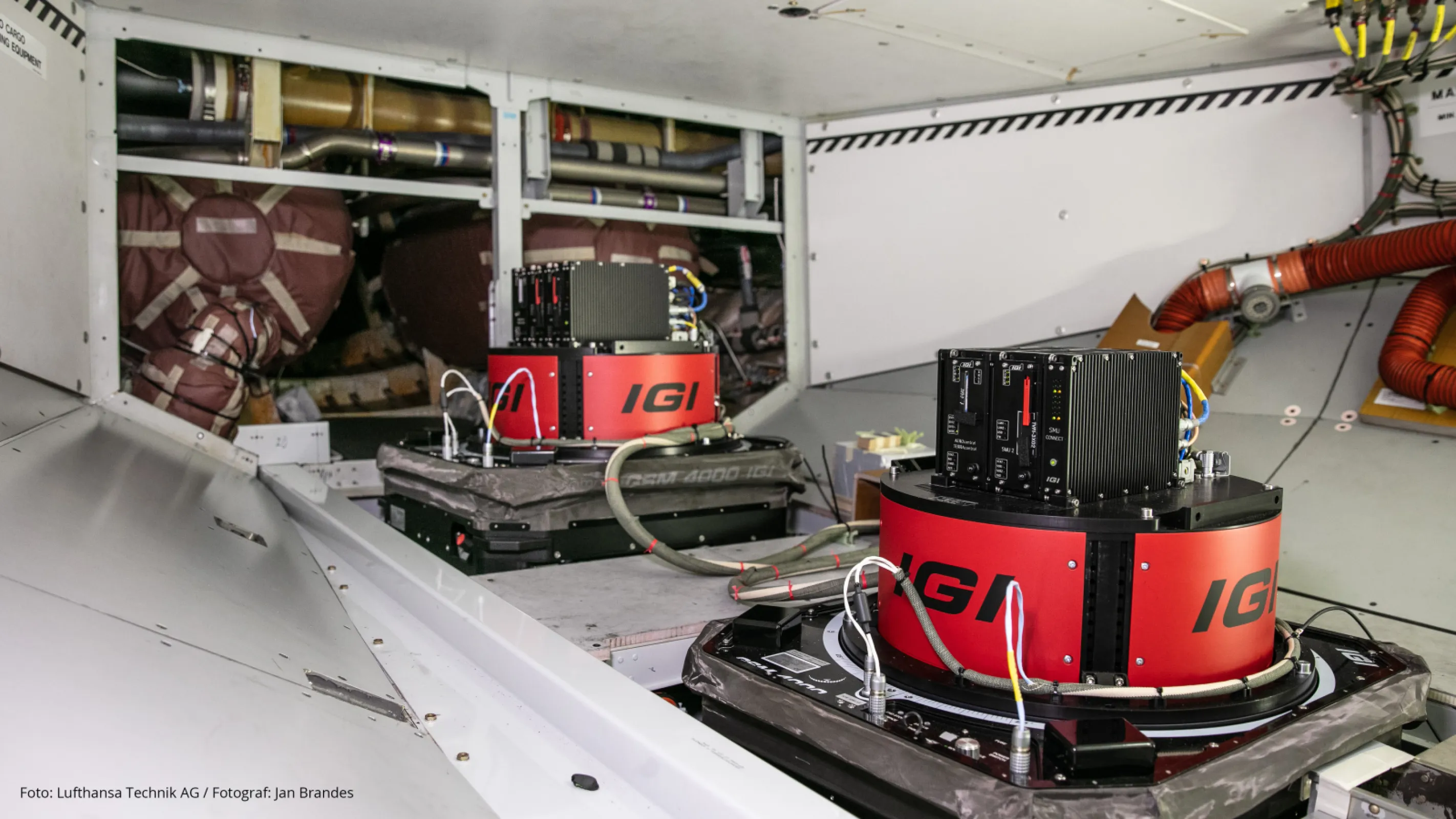 Two black SOMAG GSM 4000 OS gyro stabilization platforms with mounted sensors are integrated into a German Air Force Airbus A319 OH, operating within the framework of the Open Skies Treaty.