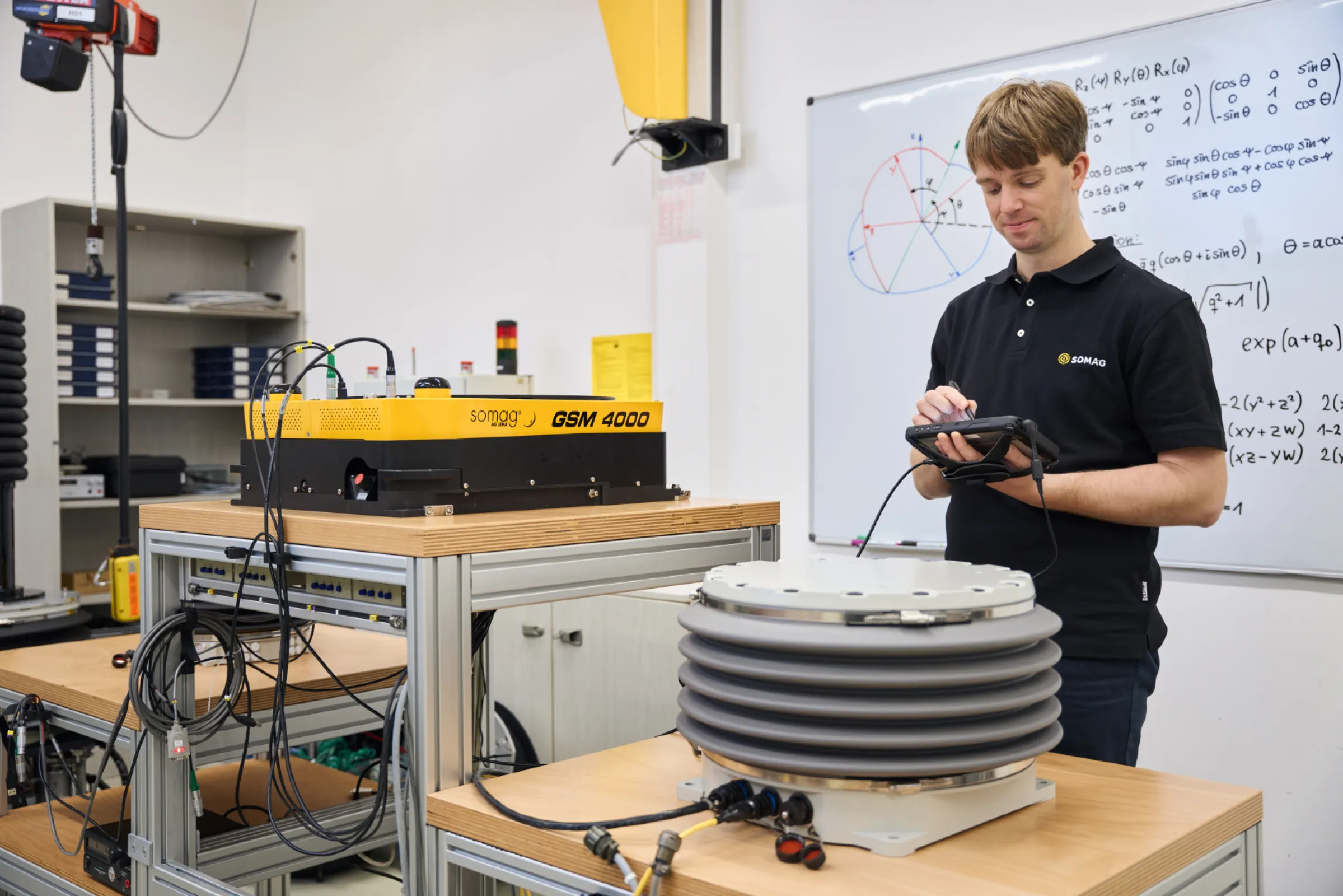 A SOMAG employee setting up a SOMAG airborne and a SOMAG marine mount at the company headquarters in Jena, Germany.