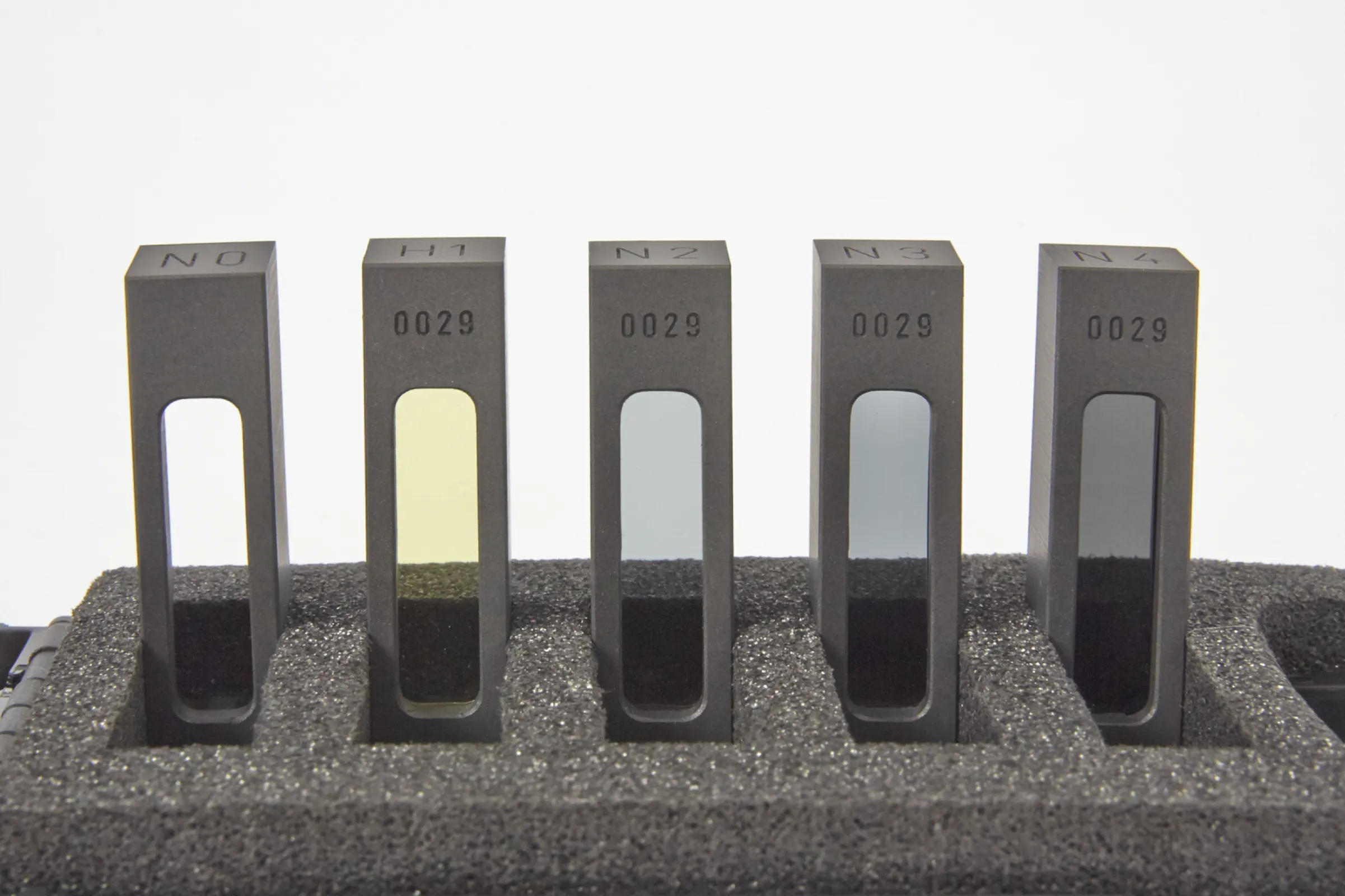 Calibration set including 1 blank, 3 x neutral density and 1 Holmiumoxide NIST tracable and certified reference cells.