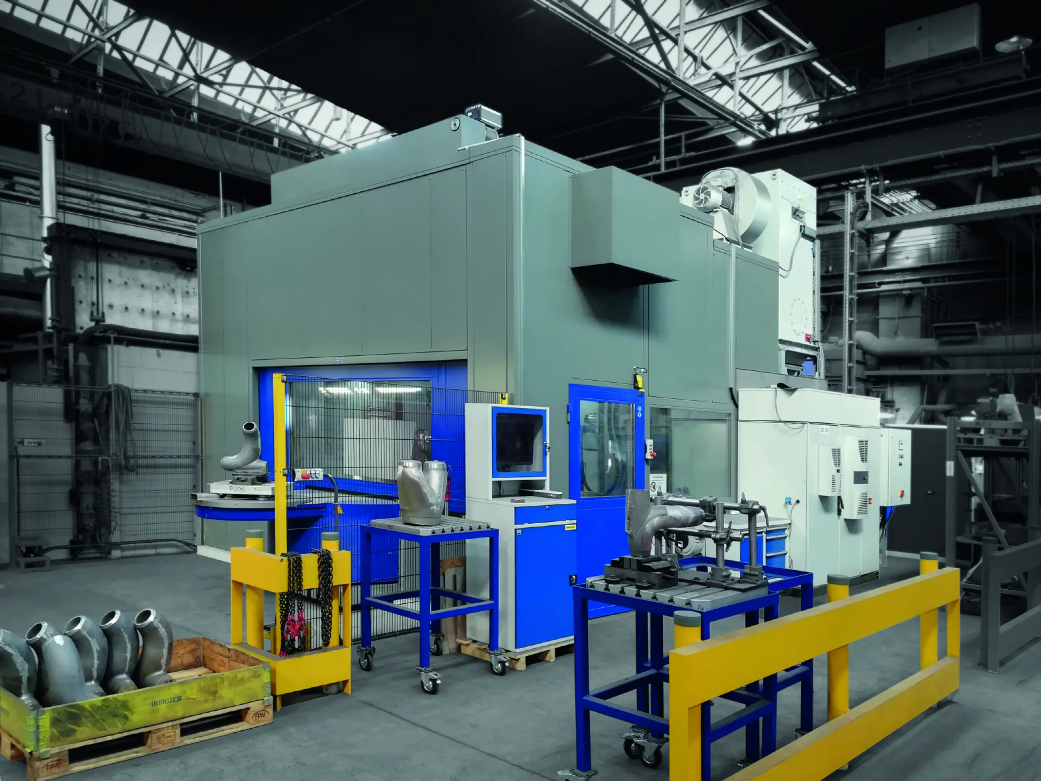 Robot deburring cell for cast parts