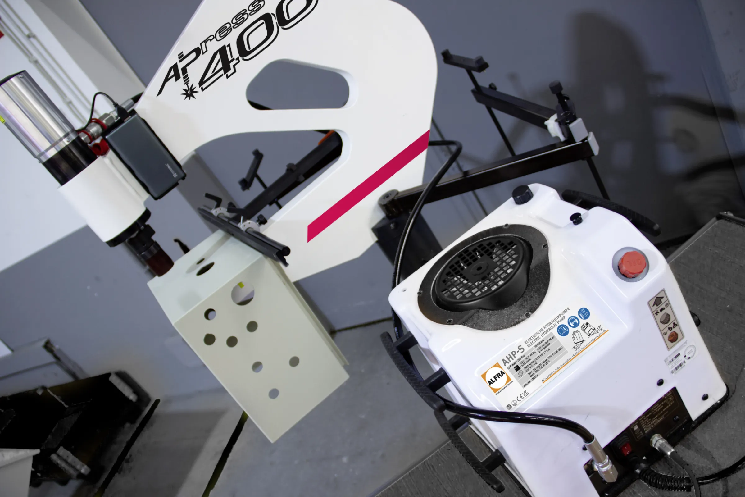 ALFRA PRESS AP 400 - stationary punching machine: Driven by 600 bar, it punches sheet steel, stainless steel, aluminium and plastic. 400 mm throat depth, 220 kg dead weight and 46 kN punching force. When it comes to punching without pre-drilling, our AP 400 is second to none - whether it's for switch cabinet housings, switch cabinet doors or mounting plates. Openings in round, square or rectangular shapes are created effortlessly.  Special shapes are also possible.