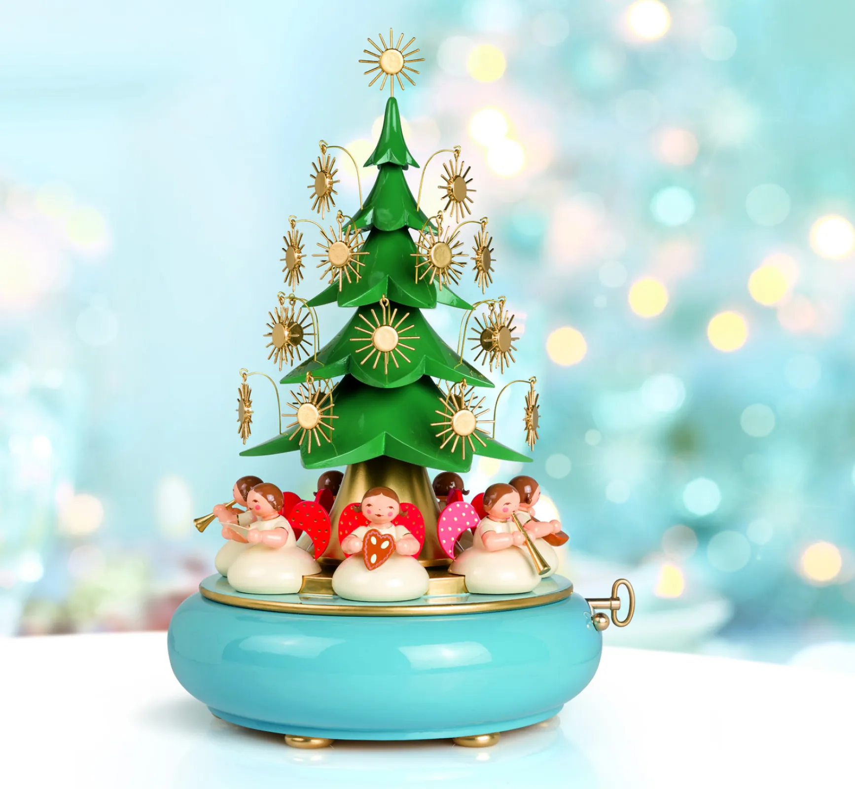 A touch of nostalgia fills the room as the Christmas tree with its elegant stars turns gracefully.