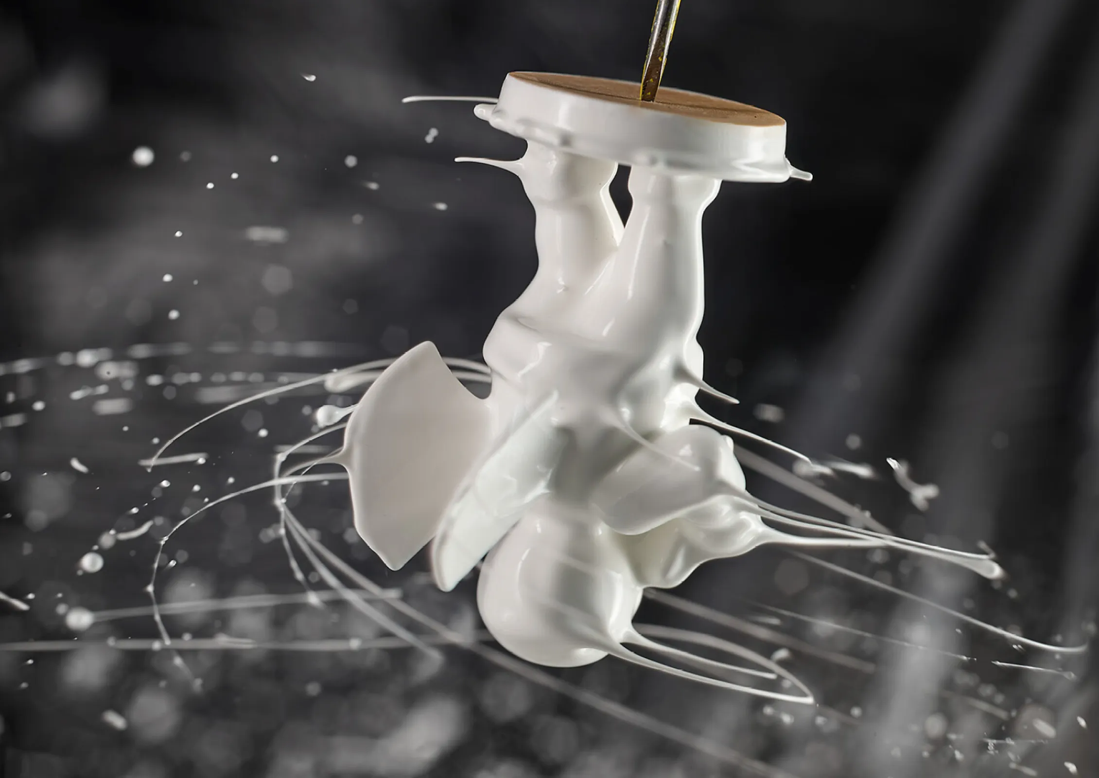 In the dipping shop, the figures are dipped in white paint. The surplus paint is thrown off.