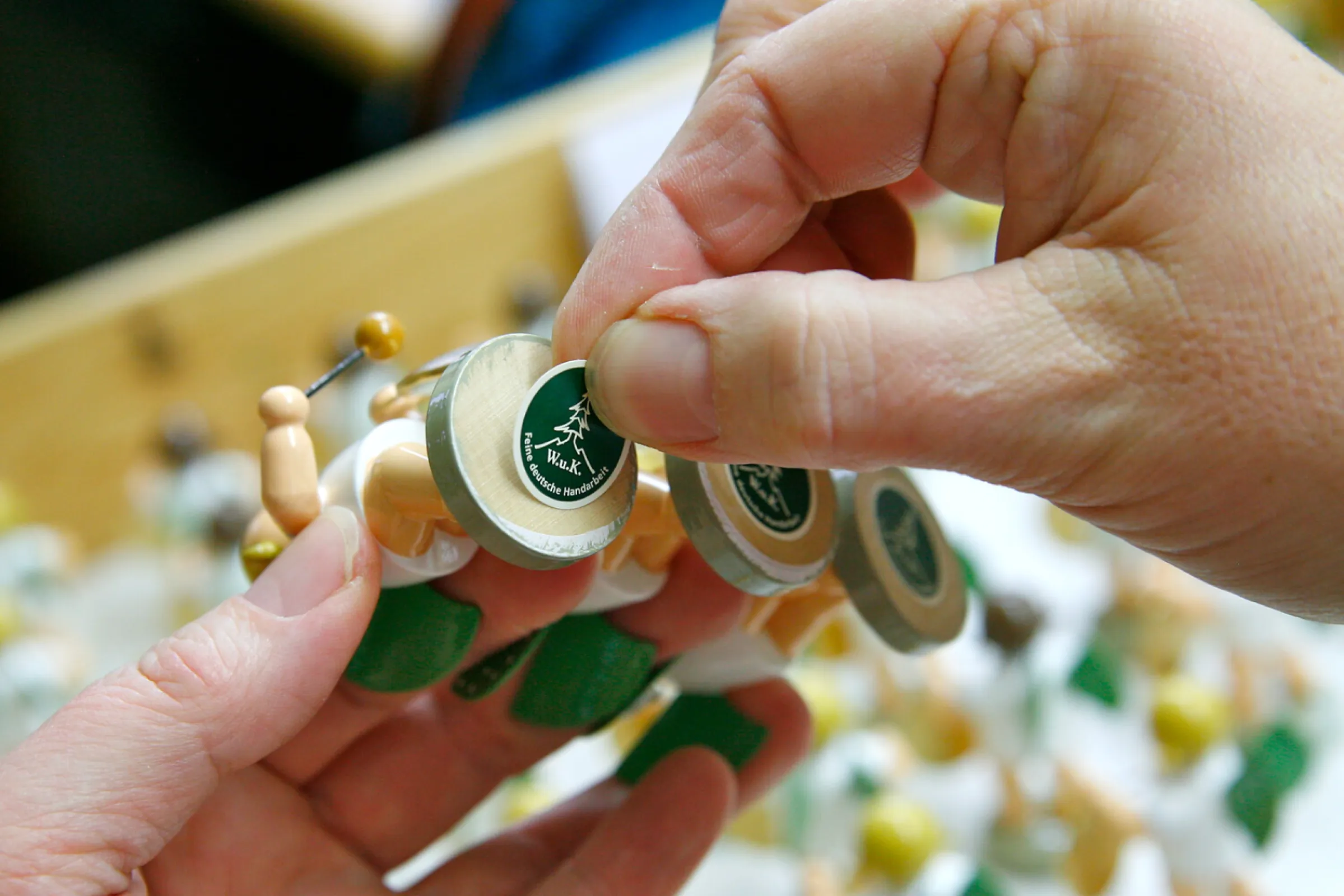 Before packing, each figurine is labelled with a bottom mark.