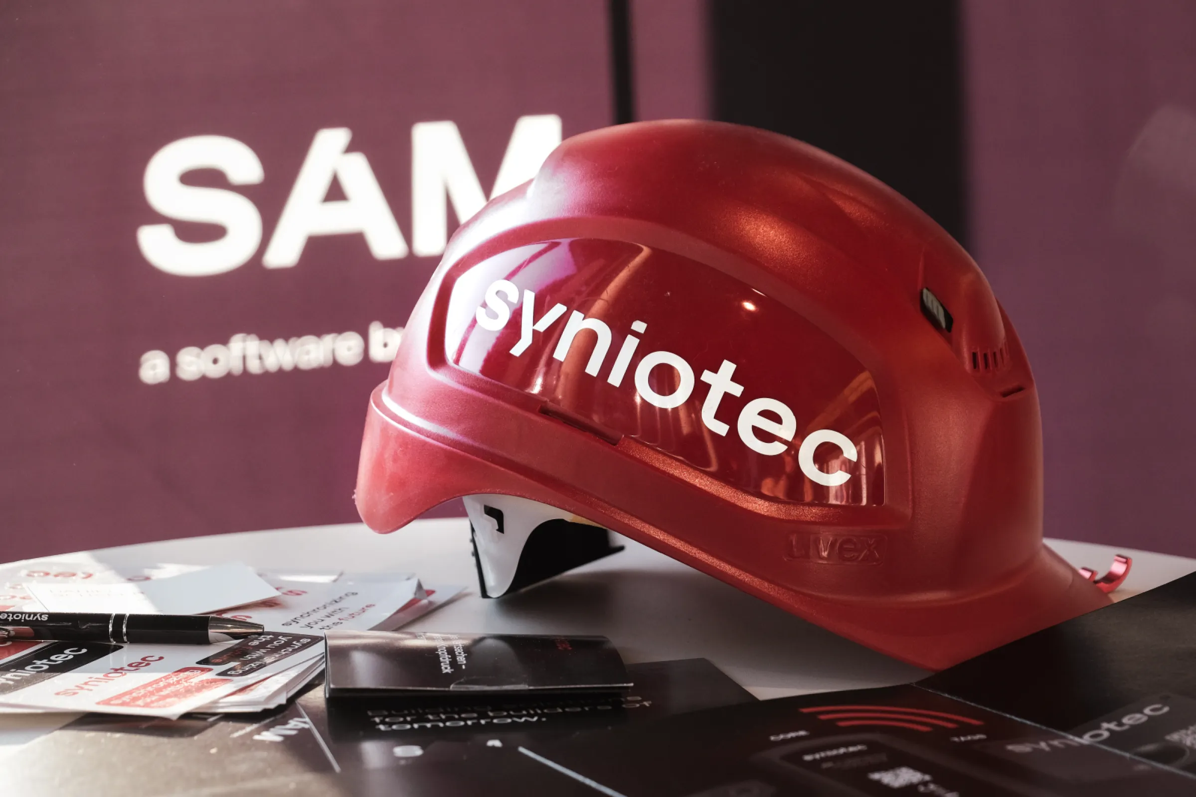 Red syniotec safety helmet – used on construction sites and at events to represent our brand in the field.