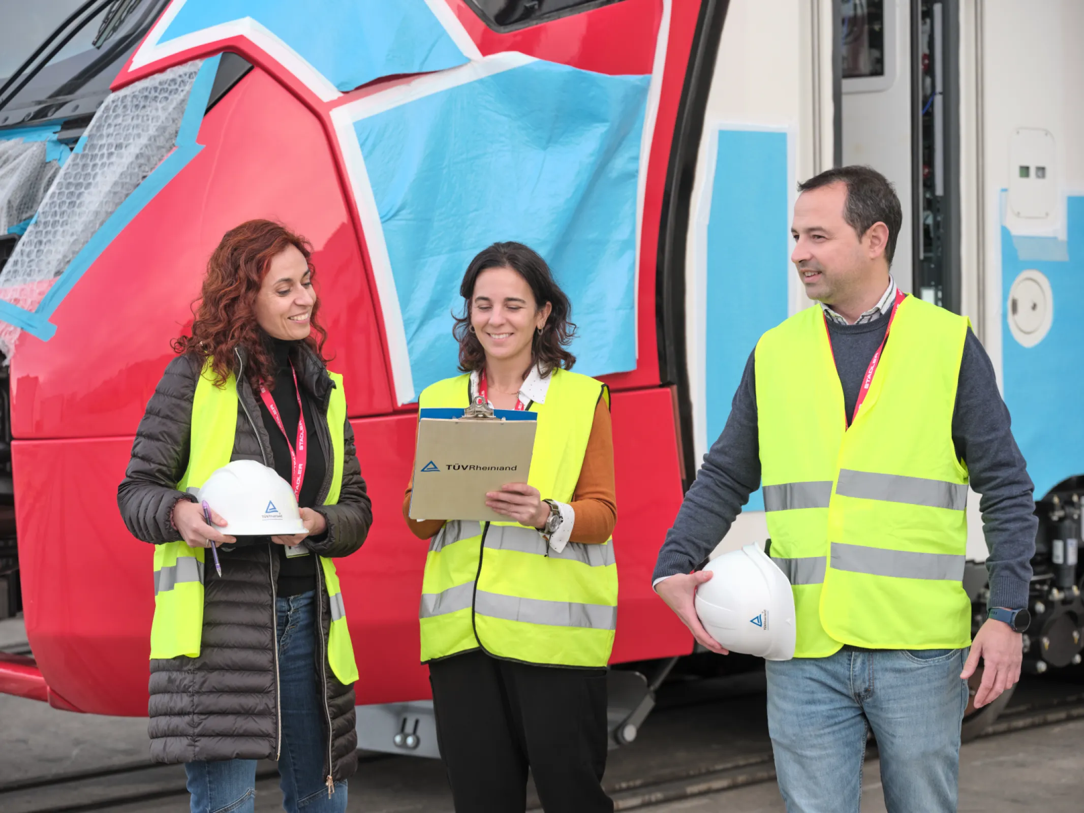 TÜV Rheinland colleagues on-site inspecting a rail system
