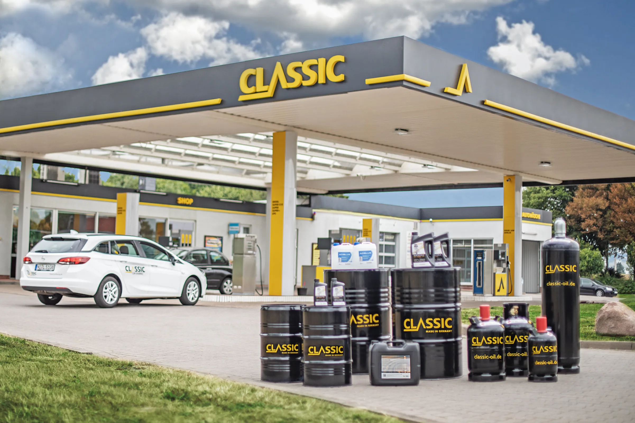 CLASSIC service station showcasing the full product range and brand identity.