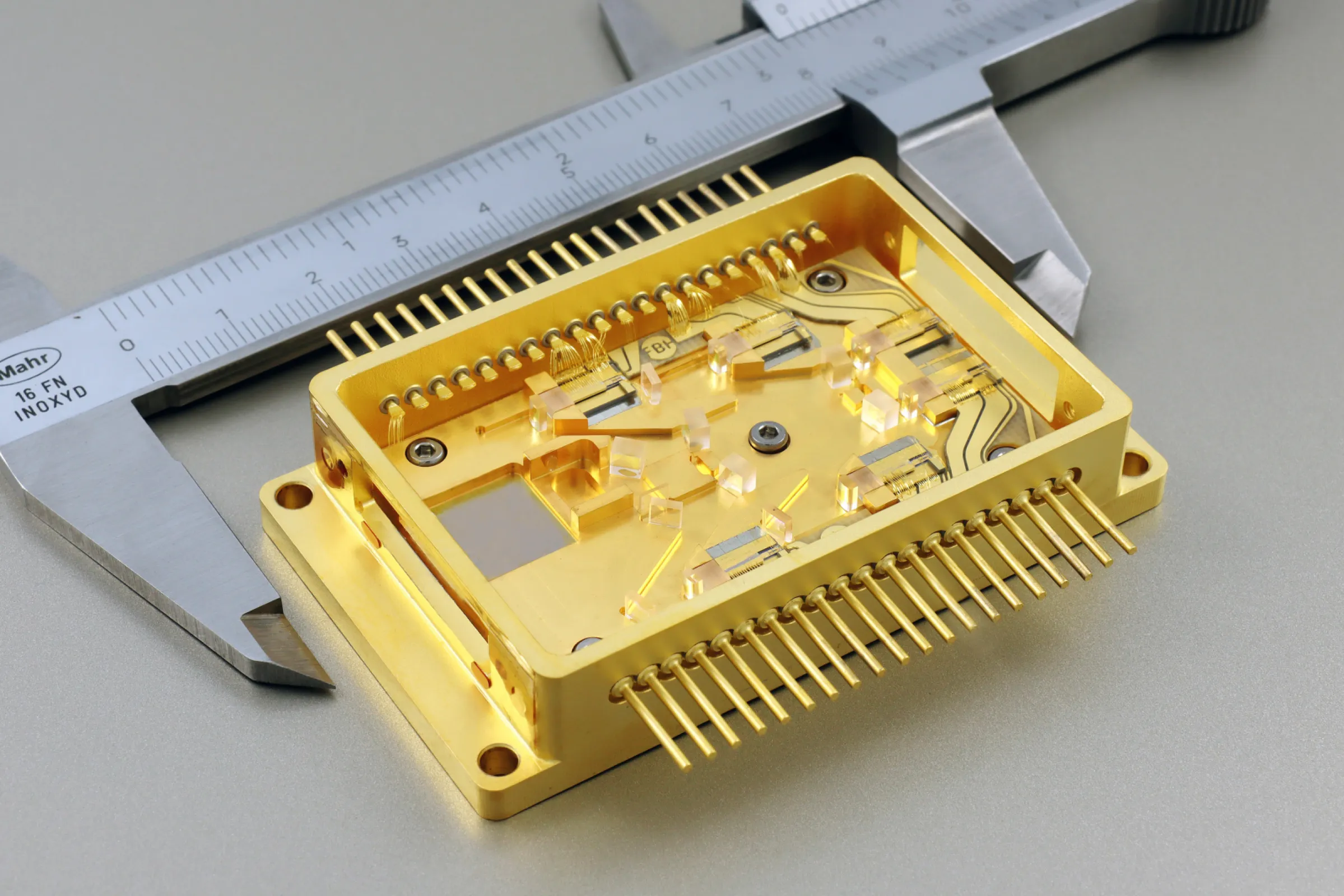 Micro-integrated diode laser module for continuous wave to femtosecond material processing