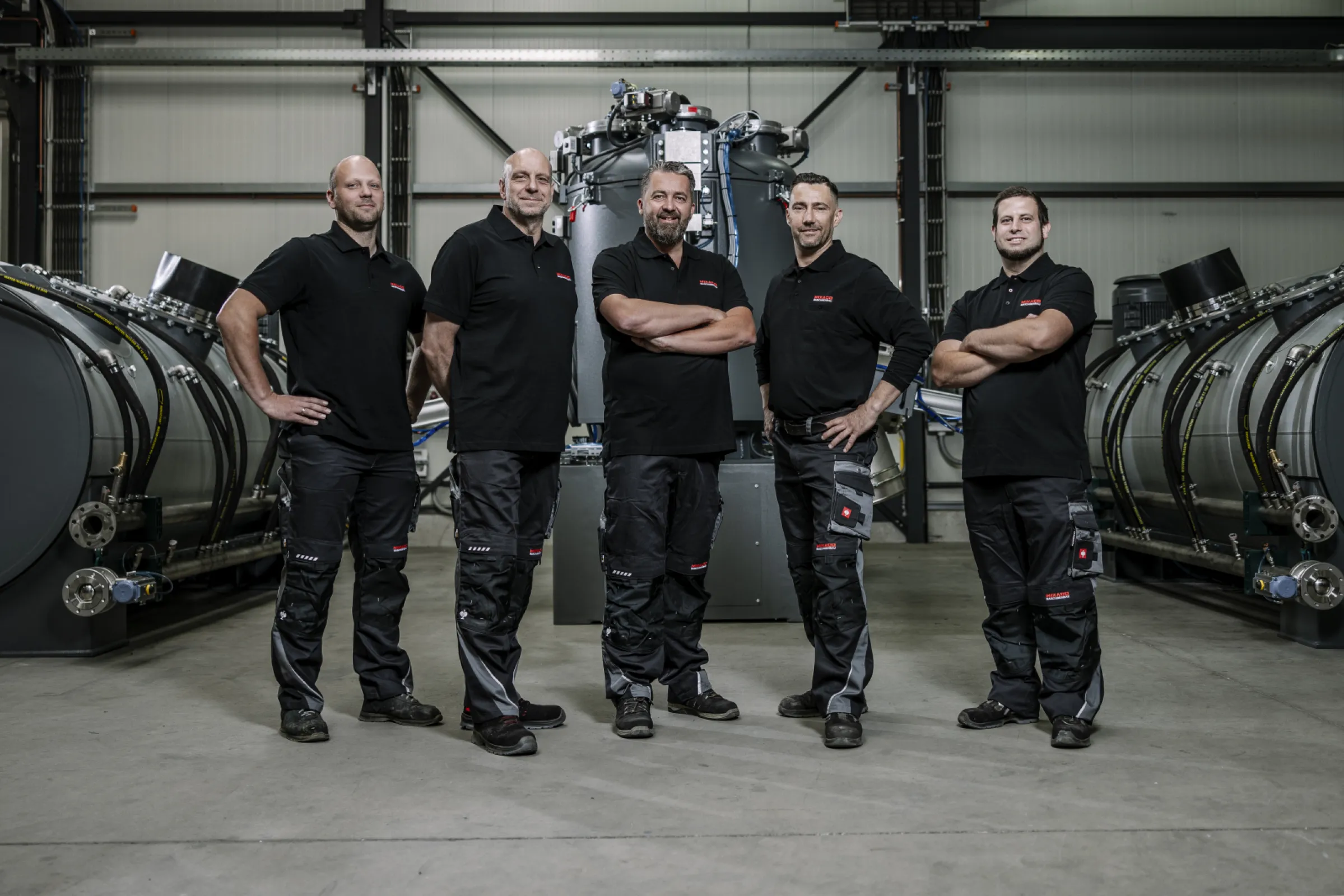Production Team in Front of Heating/Cooling Mixers