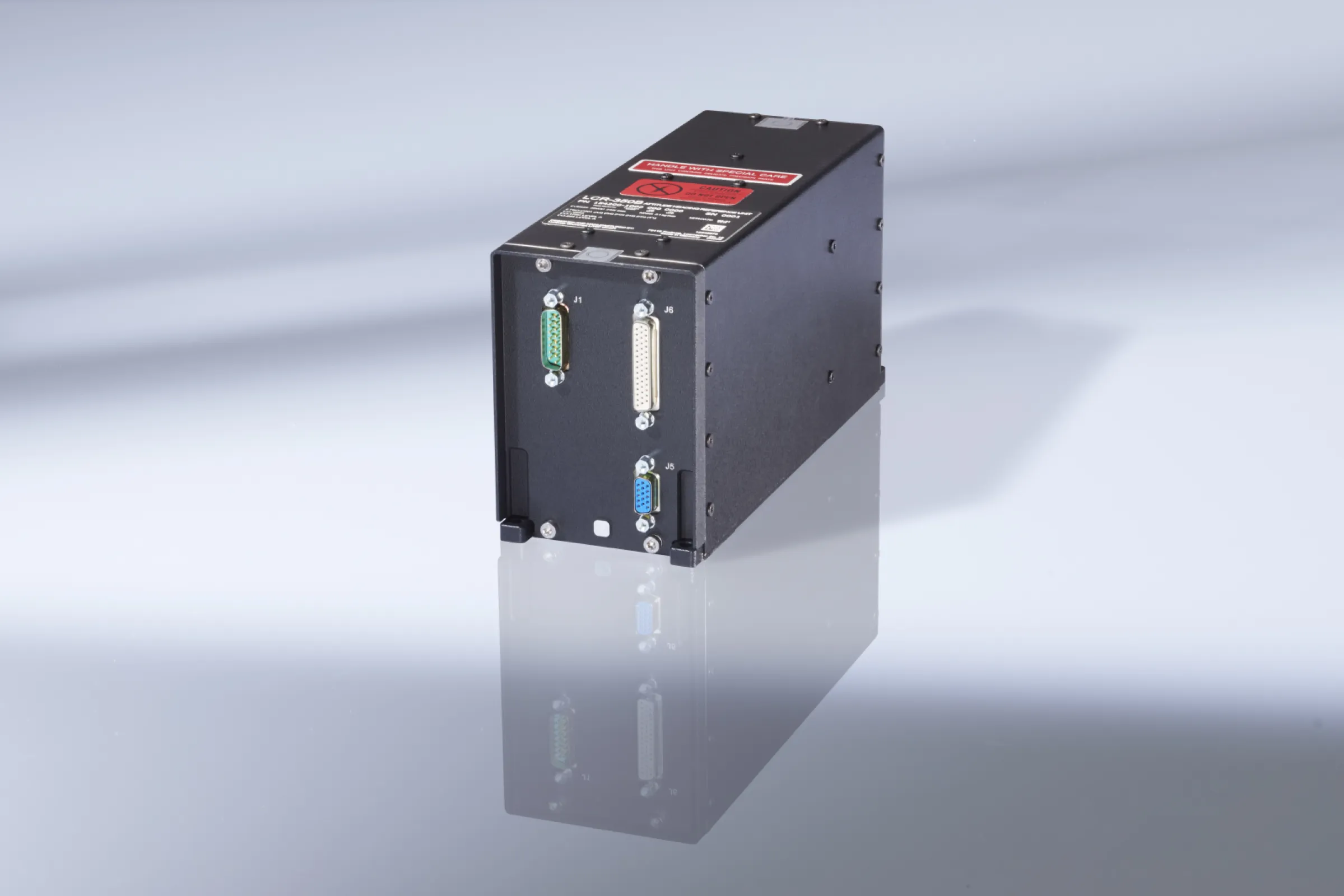 LCR-350B Compact, precise and resistant  Ultimate safety under the most demanding of conditions  Based on MEMS-technology gyroscopes and accelerometers, the LCR-350B AHRS delivers ultimate reliability under the most challenging operational conditions. Intensive research and development at LITEF have given rise to a product that - in a compact housing and with light weight - delivers superlative performance and ultimate protection against high-frequency radiation (e.g. radar).  Compared to equivalent systems based on MEMS technology, the LCR-350B provides enhanced precision and resistance to vibration right across the entire operational range. As well as the heading & attitude angle, the LCR-350B outputs physically robust acceleration and rotation data, so it delivers an attractive solution for use in all kinds of aircraft and helicopters.  The system obtains its heading reference from an external magnetometer. Whenever GNSS data is supplied to the system, it can also output hybrid navigation data with a high bandwidth and low noise. The LCR-350B outputs its signals across an ARINC 429 interface to the cockpit system and if required, it gives the pilot the option of switching into free inertial heading mode (DG mode).  The LCR-350B supplements the existing fibre optic AHRS systems from LITEF and is certified in accordance with ETSO/TSO C-201.