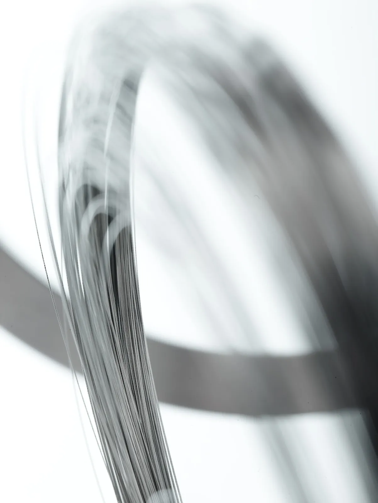 Stainless spring wire for syringes and other surgical needle related devices