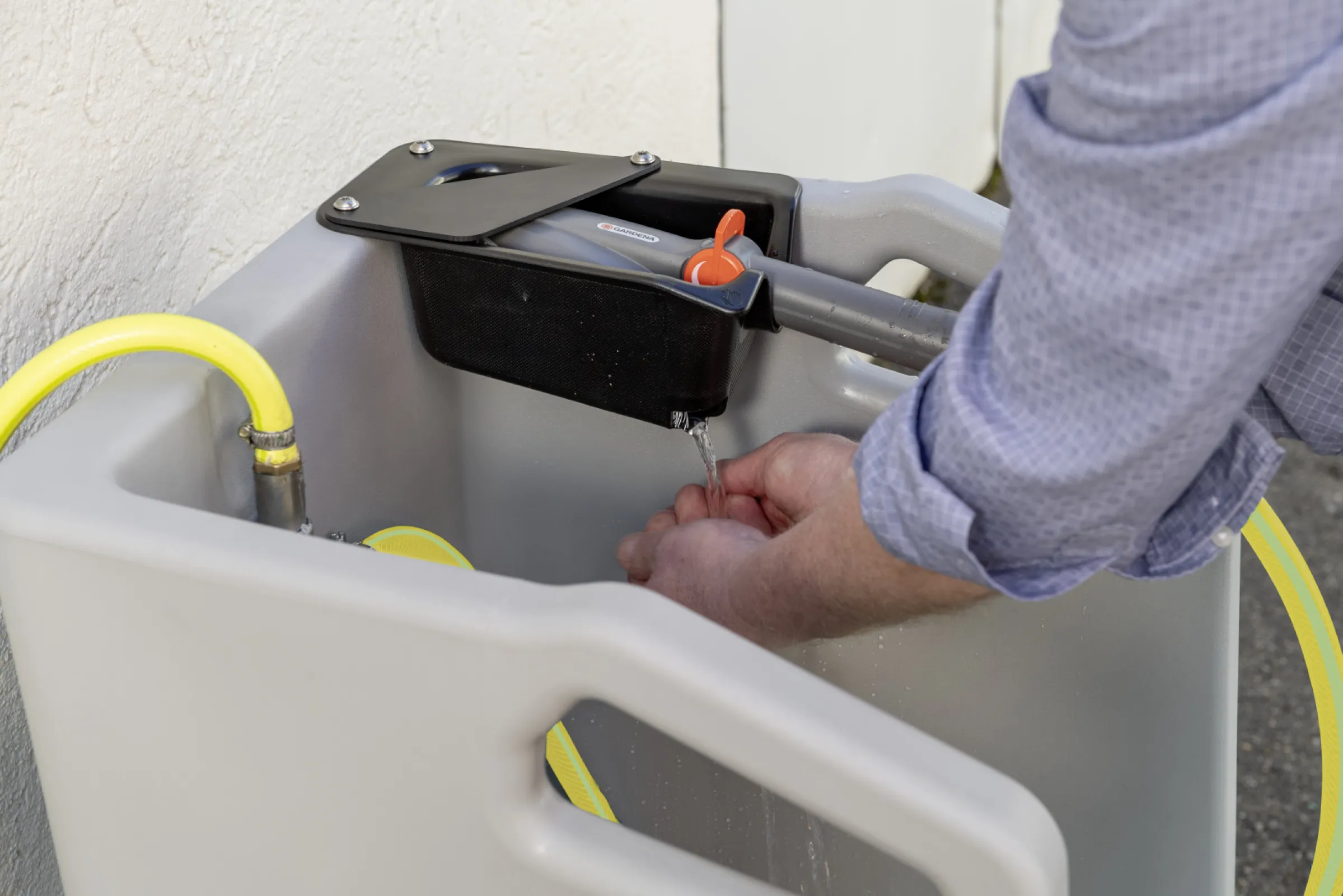 Boot cleaner with integrated sump and hand brush