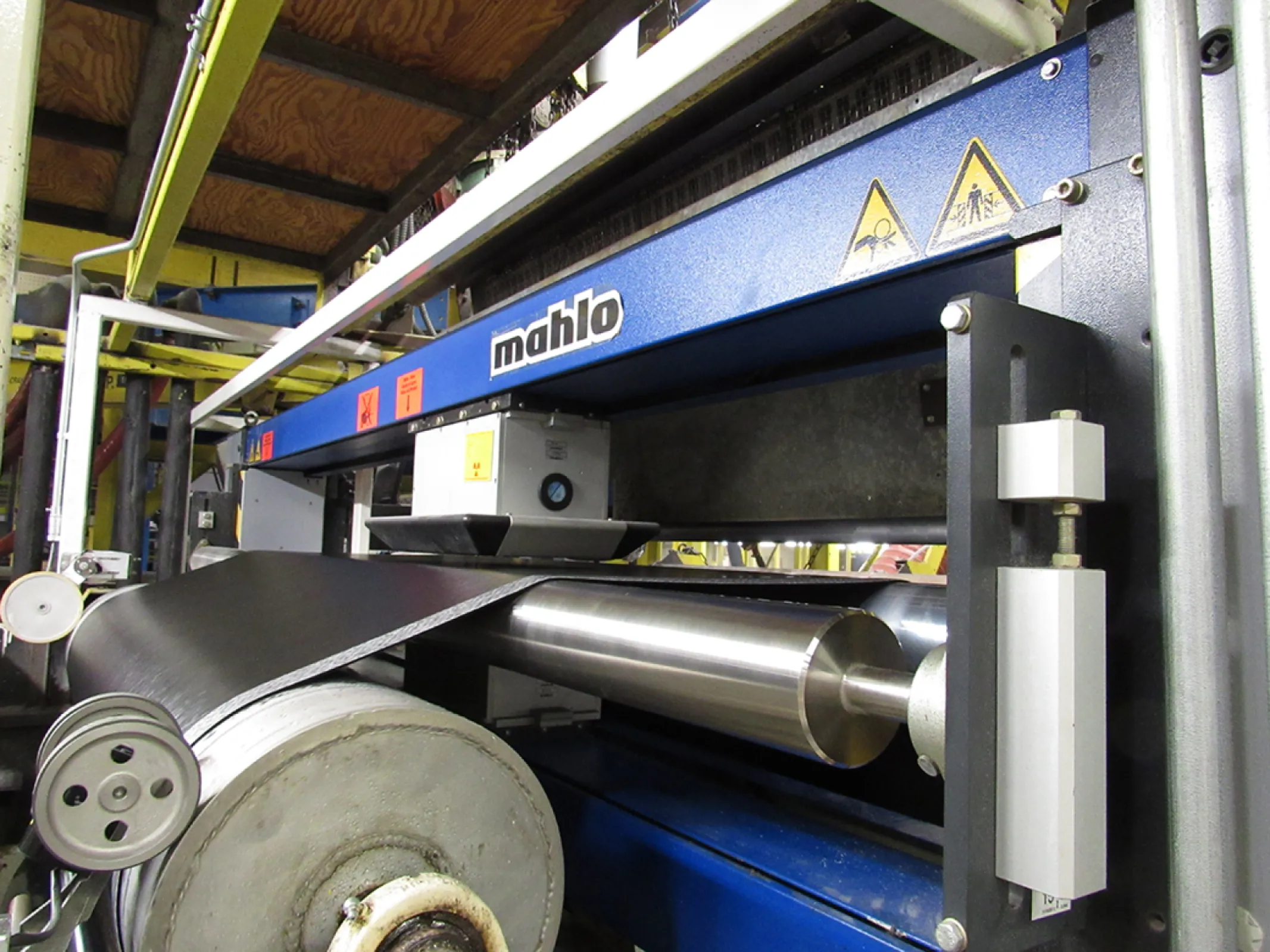 Thickness and basis weight measurement of an extruded TPO web. It is later processed into convertible tops.