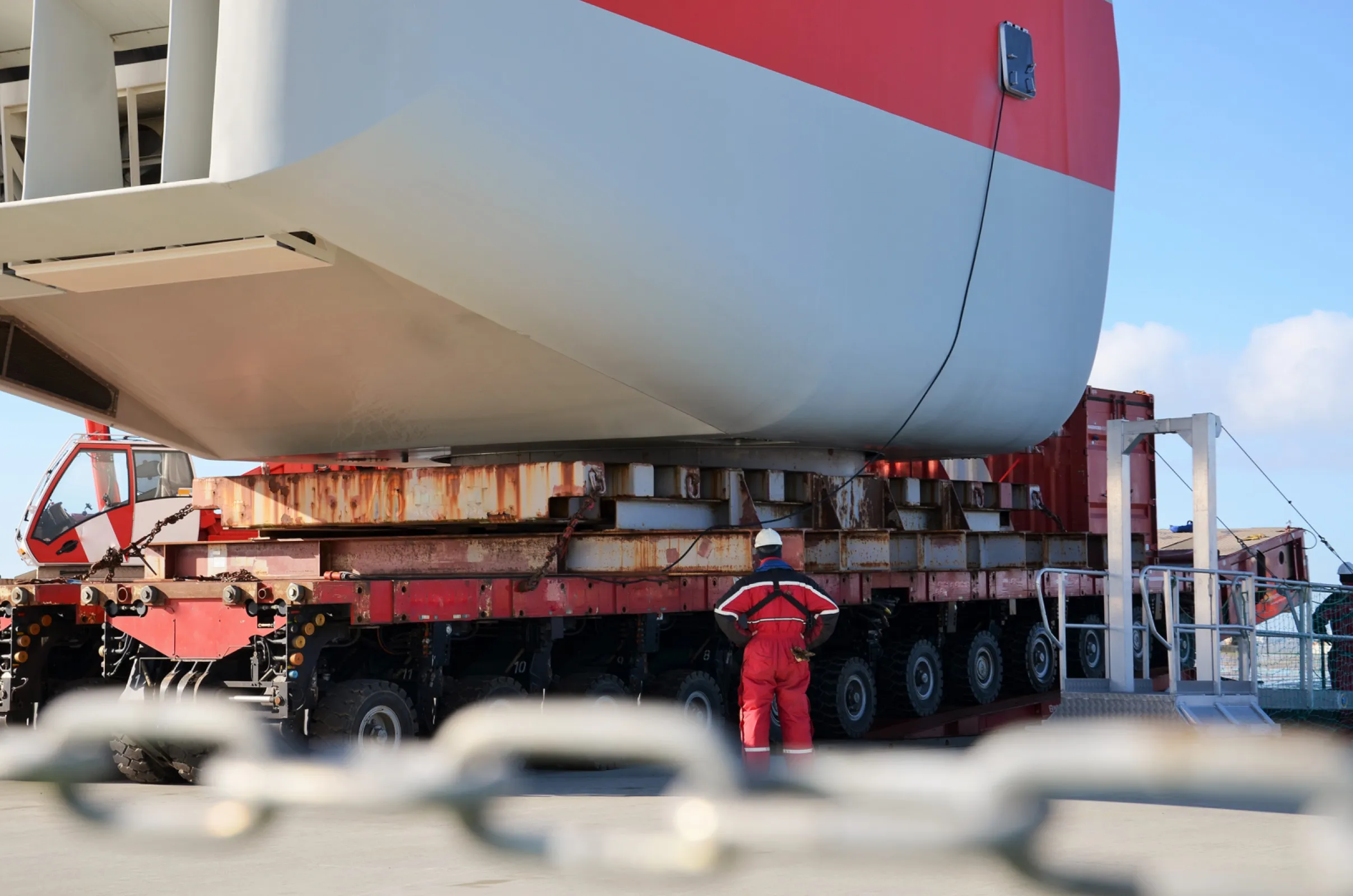 A nacelle loaded onto a barge via SPMT during a major component replacement campaign at Port Knock (Emden)