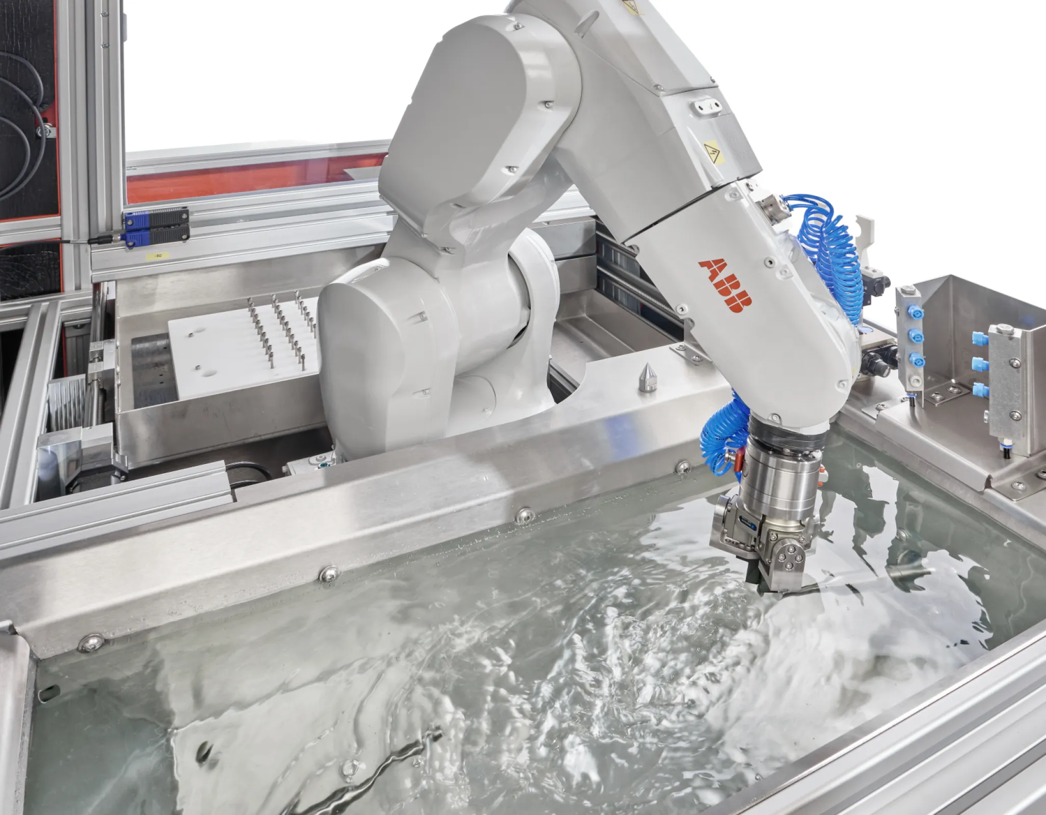 An industrial robot is used to guide the components to the ultrasonic horns in a defined position.