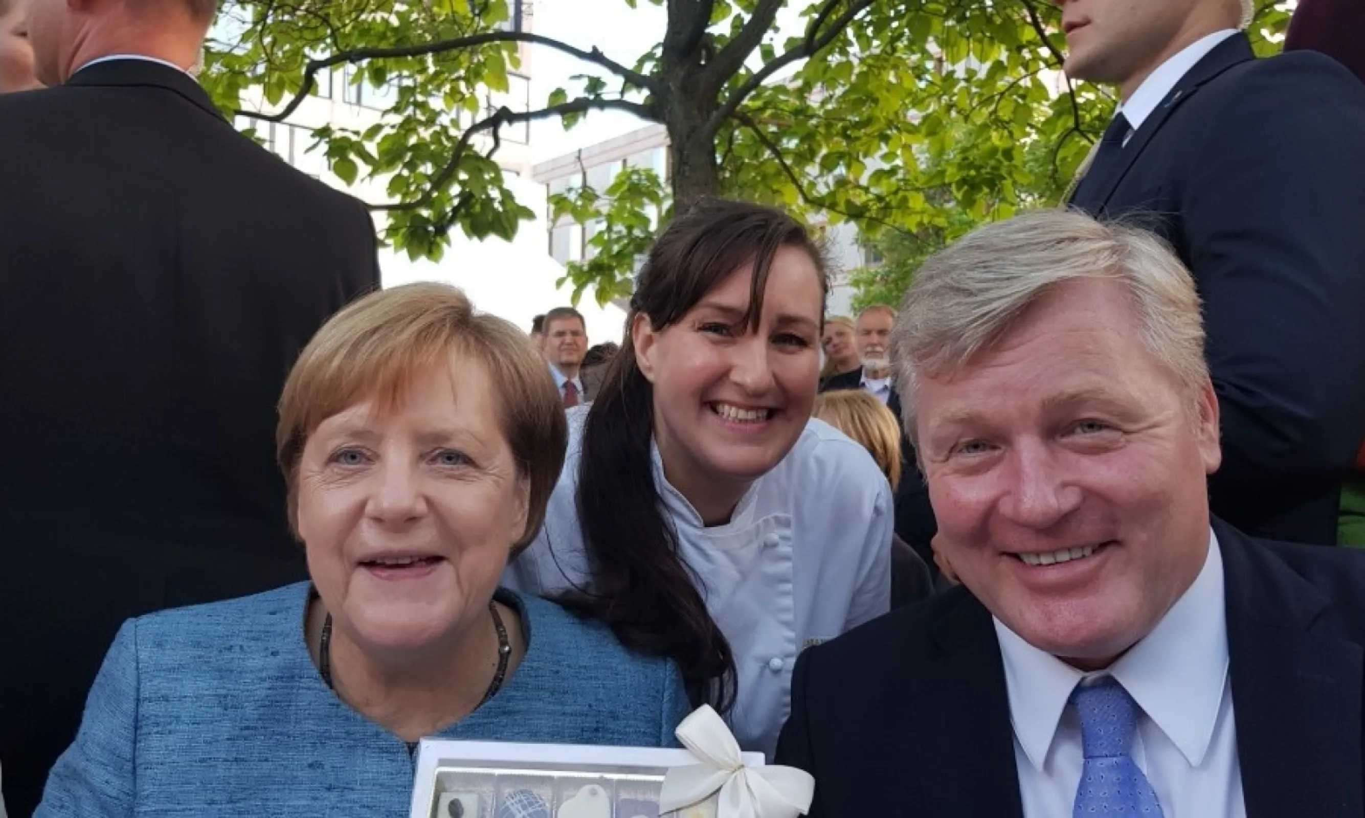 The chocolate plant owner meeting with former german chancelor Angela Merkel and german minister