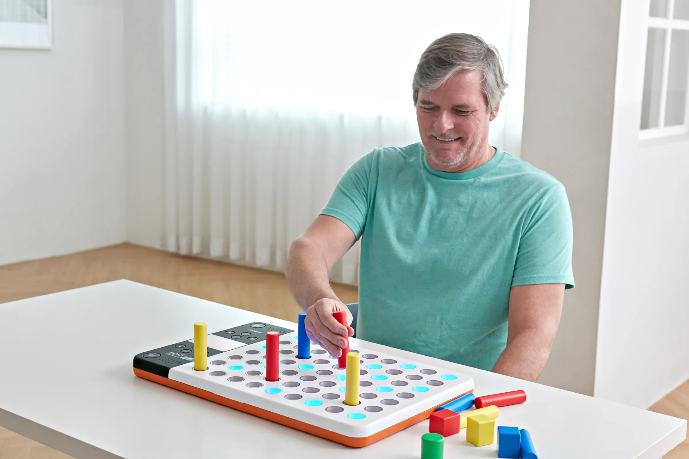 The Neofect Smart Pegboard provides visual and auditory feedback to motivate users through gamified training.