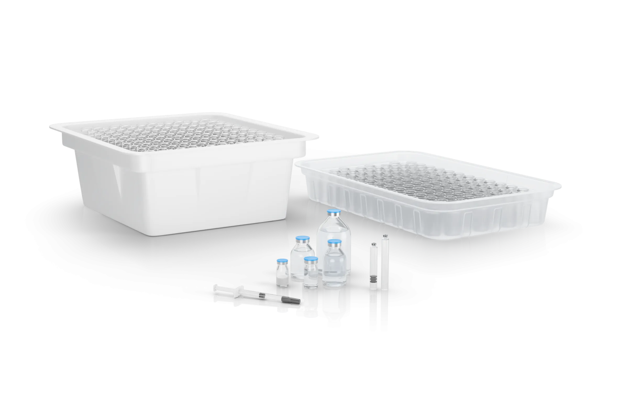 Filling of syringes, vials, and cartridges into nests, trays, or bulk containers