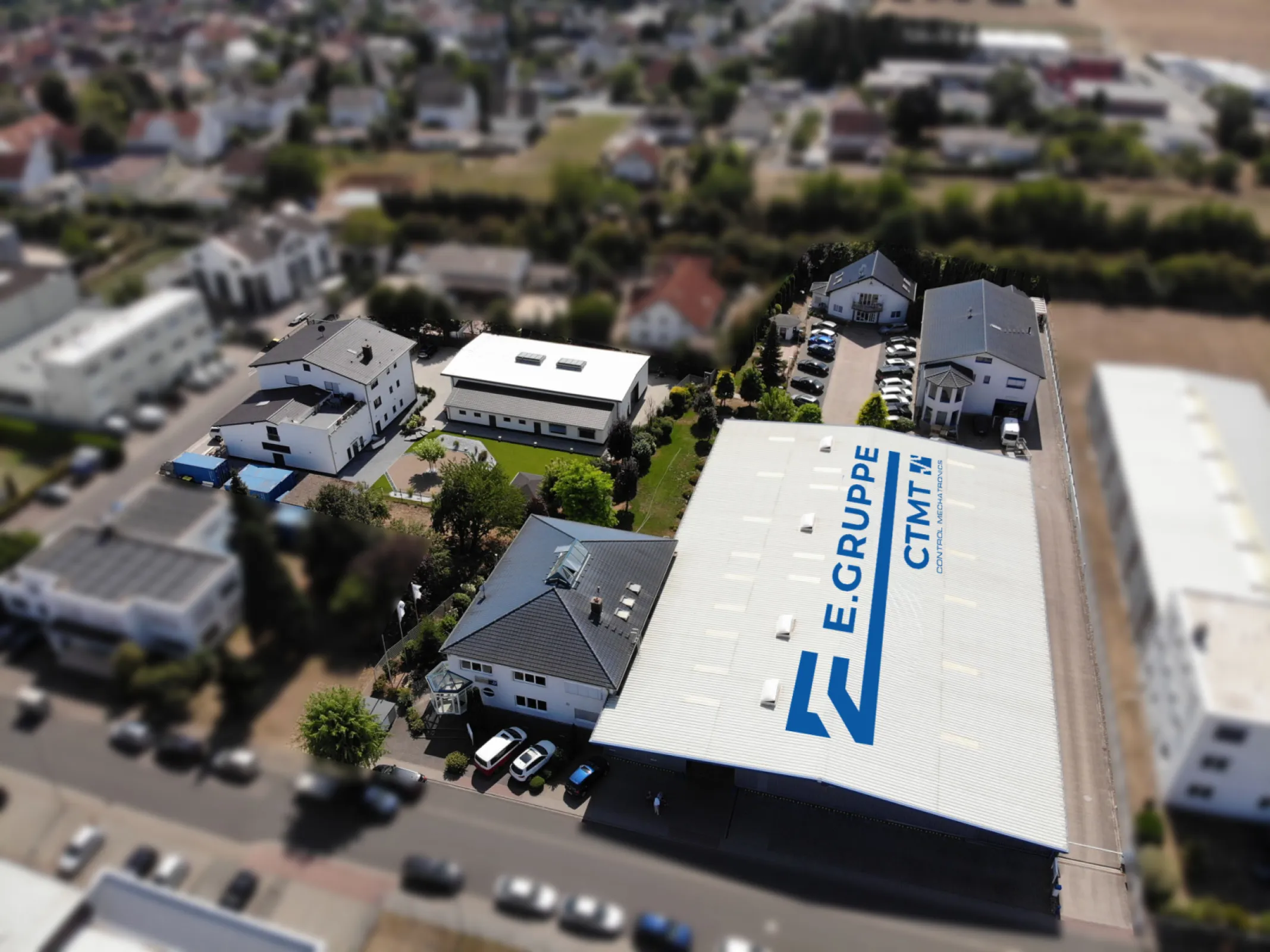 Aerial view of the Control Mechatronics headquarters in Germany, showing production, warehouse and office buildings – reflecting integrated engineering, manufacturing and project execution from a single source.