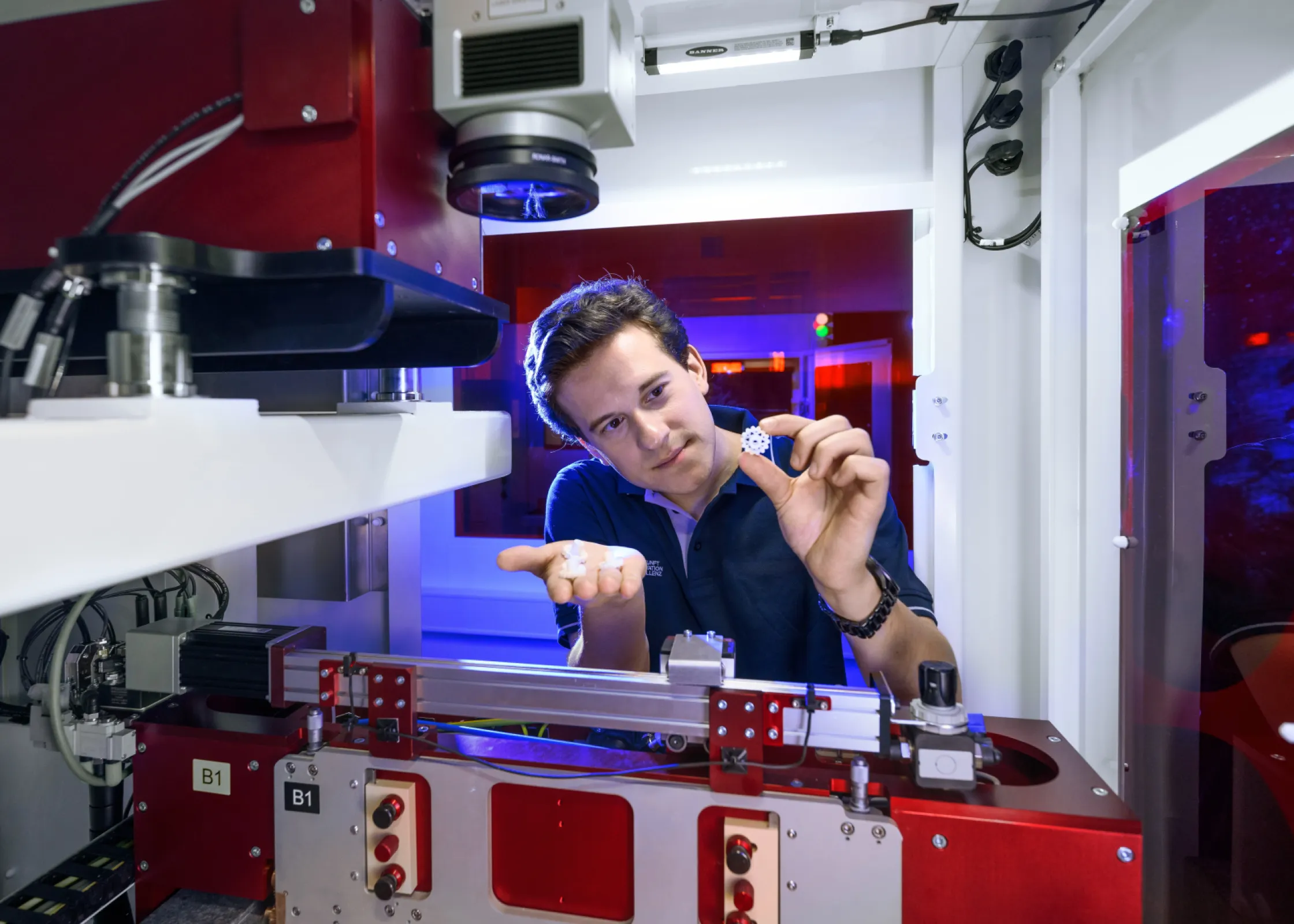 The contract manufacturer uses multiple production technologies; shown here is an SLA printer.