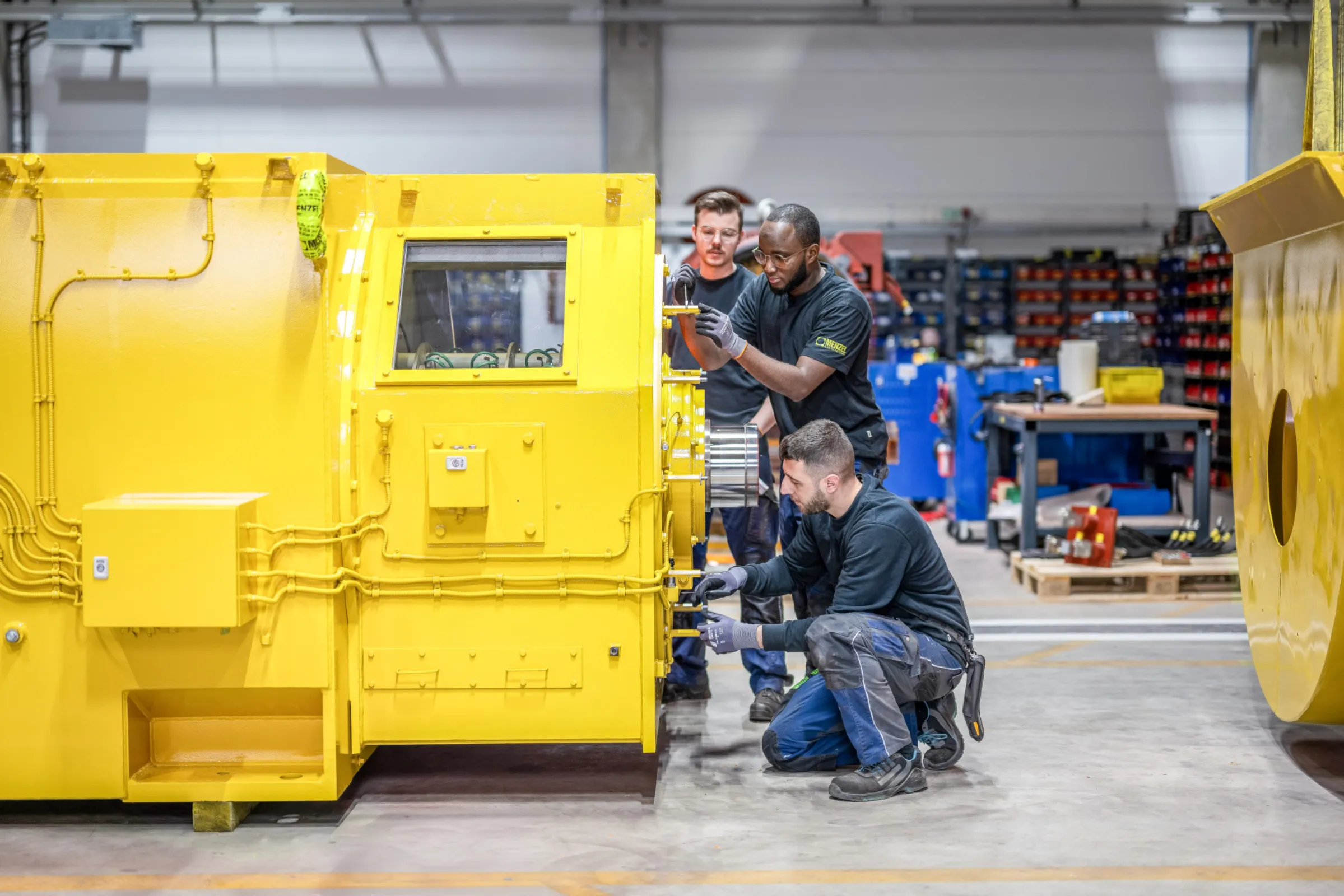 Technicians working on slip ring motor
