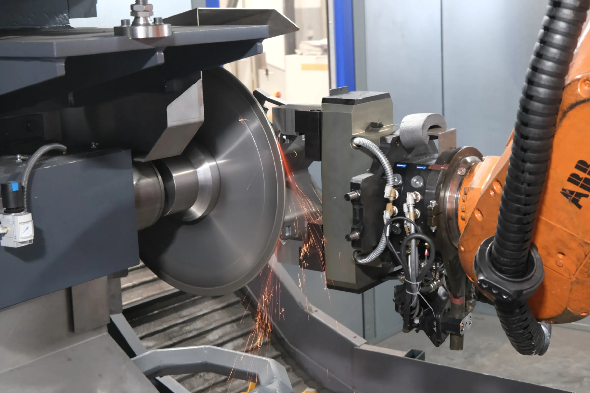 Robotic machining with a milling and deburring station