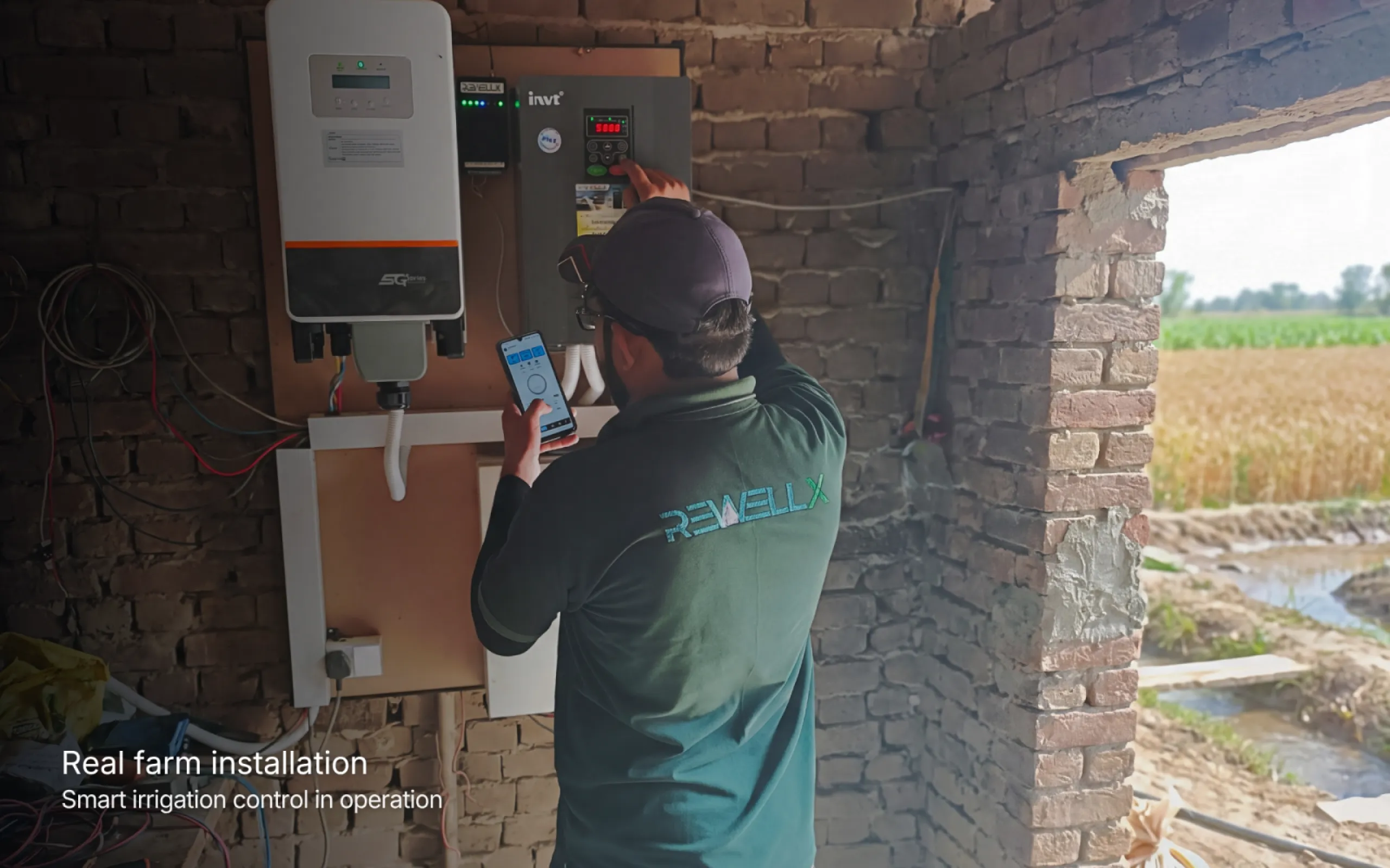 Rewellx field technician commissioning a smart irrigation installation and verifying remote pump operation through the mobile application.