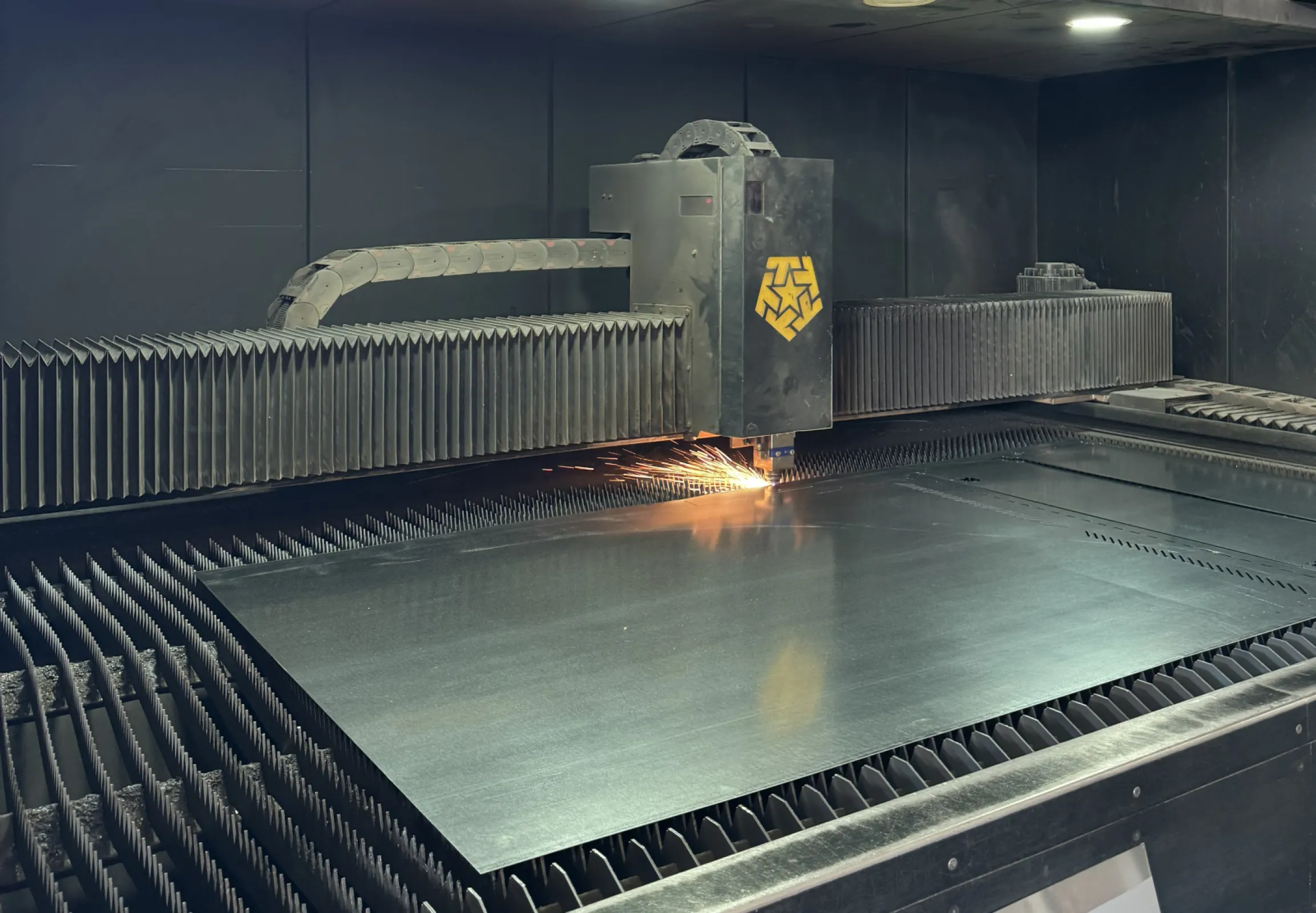 Laser cutting of sheet-metal components for laboratory equipment manufacturing.