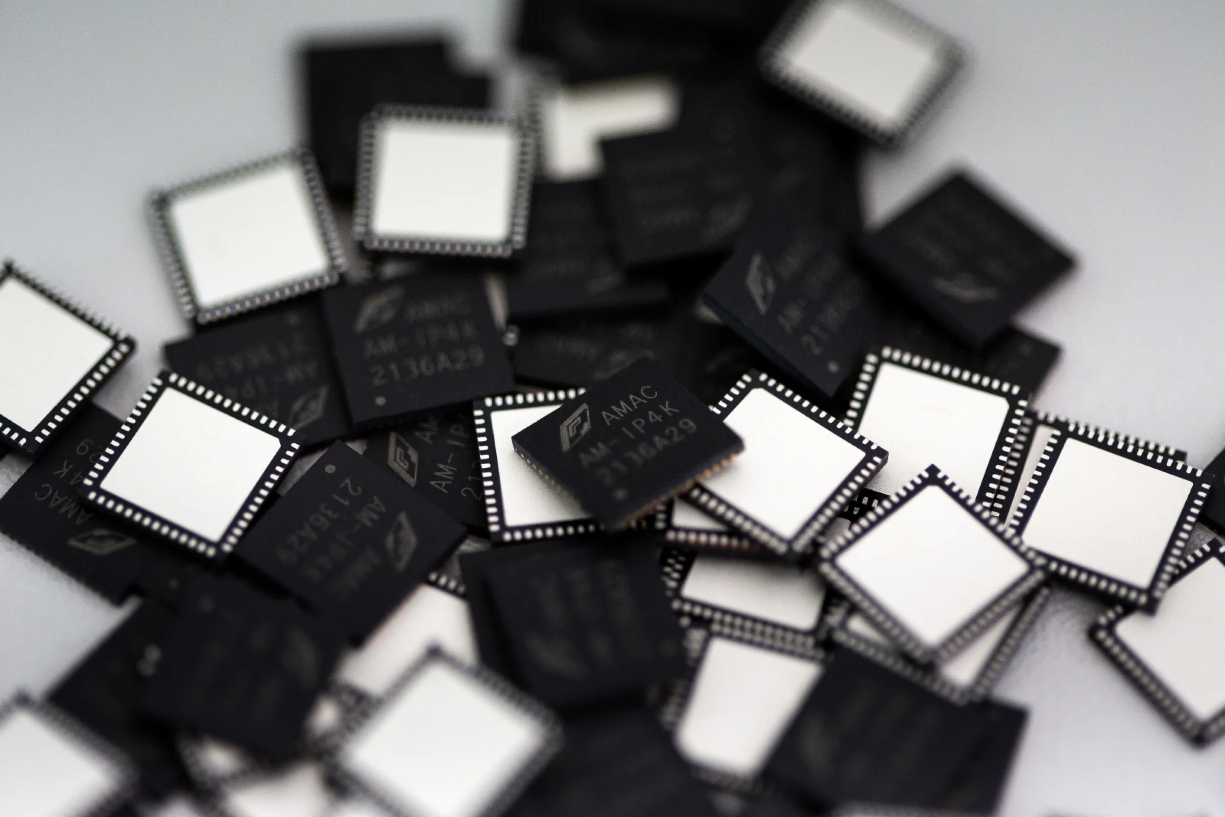 Close-up of integrated circuits representing AMAC’s custom ASIC and mixed-signal development expertise. Close-up of integrated circuits representing AMAC’s custom ASIC and mixed-signal development expertise.