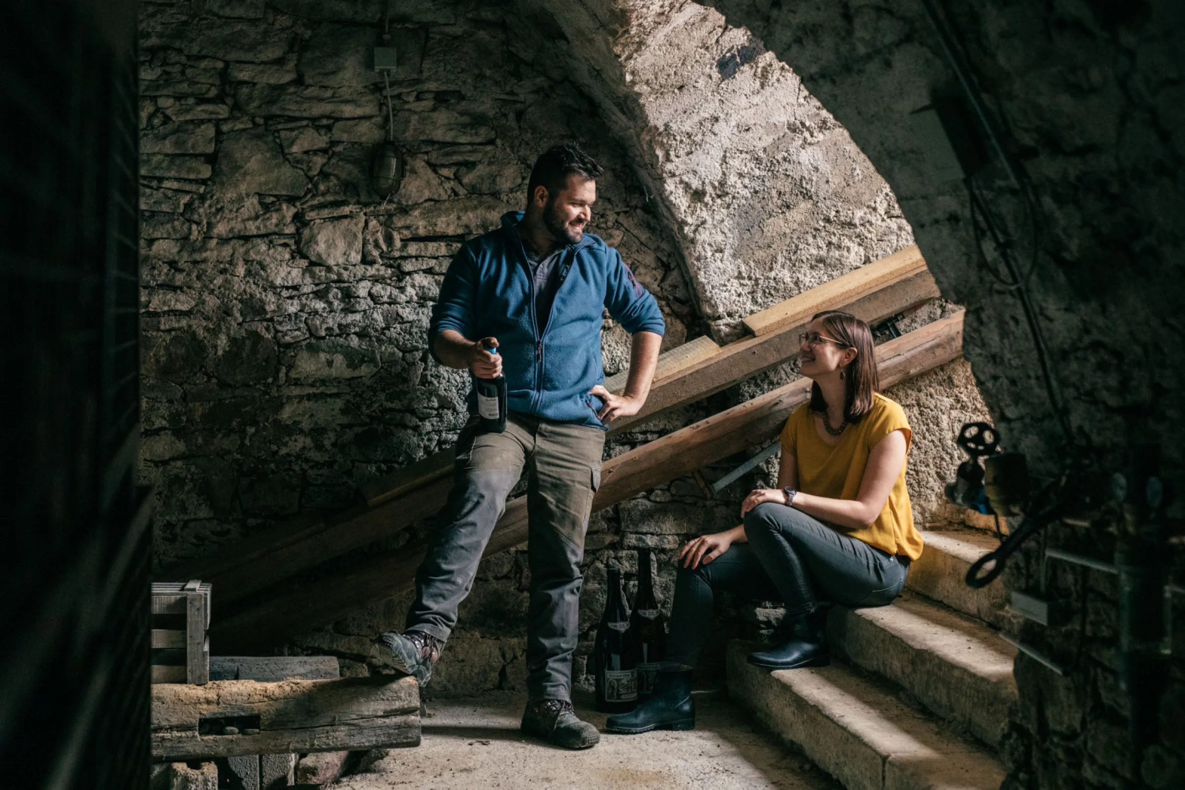 Johannes Kopp and his wife Alina in the 400-year-old vaulted cellar, where selected vintages are aged in bottle for selected clients.